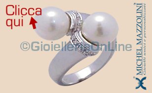anello contrariè in oro bianco con due perle e diamanti
