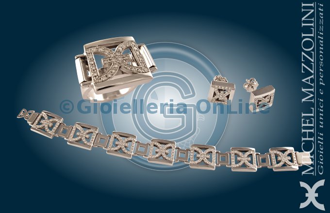 collezione City by Night, tre gioielli in oro bianco 750/1000 con diamanti. Logo con diamanti traforato a formare un prisma con base quadrata.